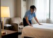 Hotel staff preparing certified textiles