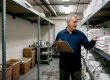 Hotel staff checks linen stock in storage room