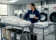 Laundry manager checks linens in hotel laundry