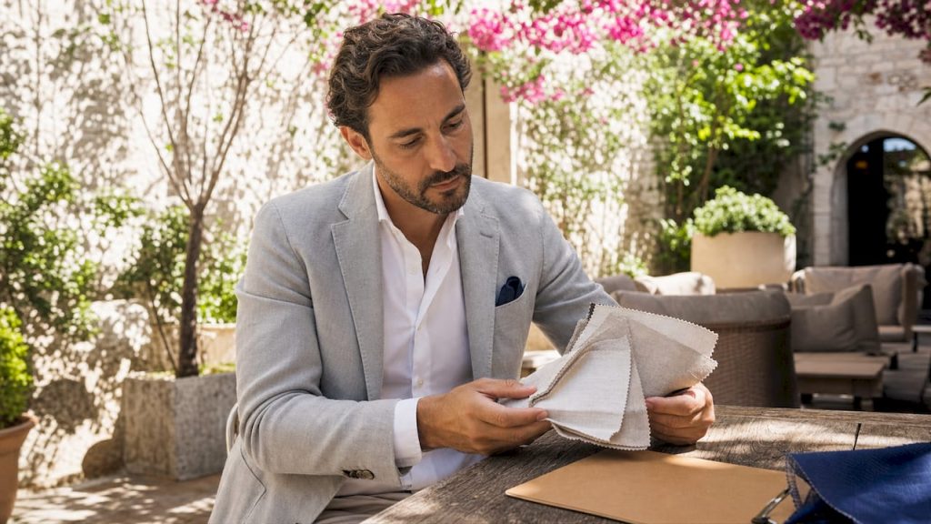 Procurement specialist examining luxury hotel fabrics